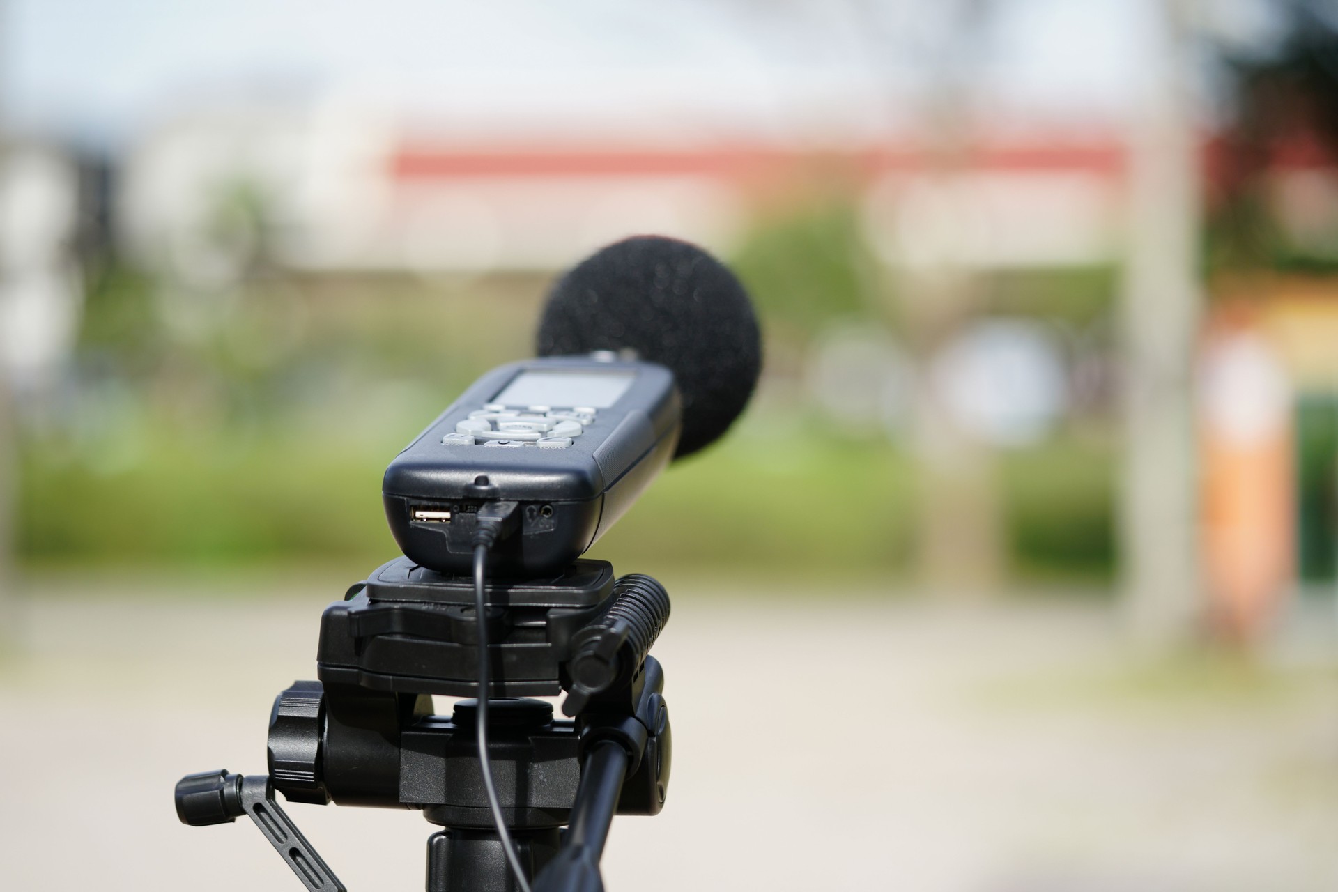 Measuring the noise on the road with a sound level meter. Sound level meters are commonly used in noise pollution studies.